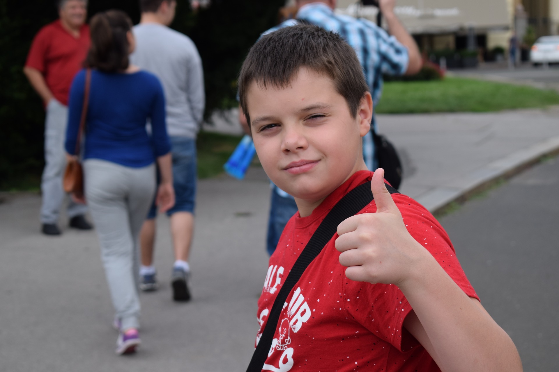 Boy giving thumbs up A boy gives a thumbs-up gensture